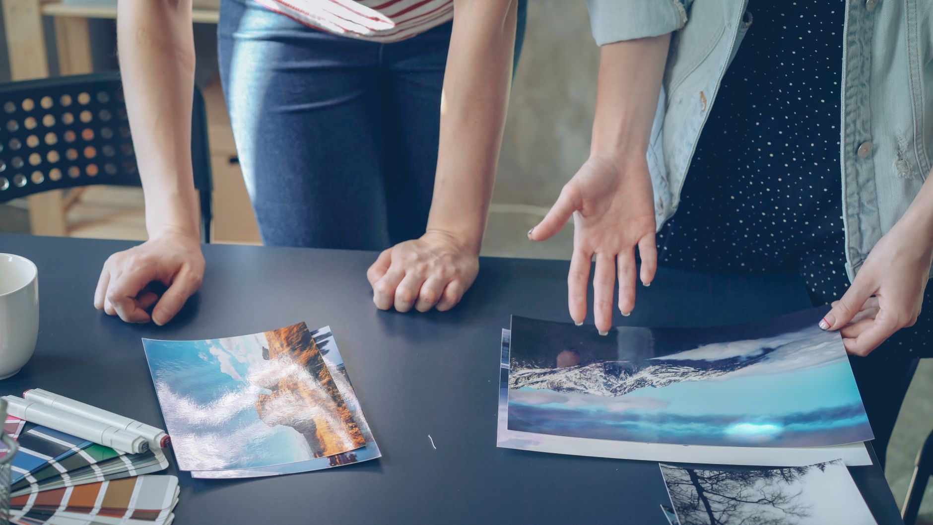 Travel journal editors curating print proofs